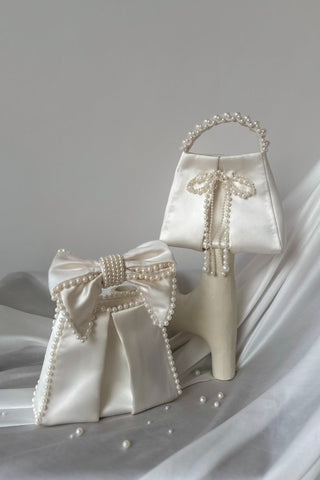 White satin bag with pearl bow