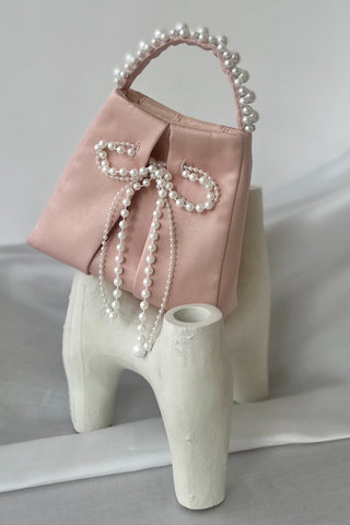 Blush satin bag with pearl bow