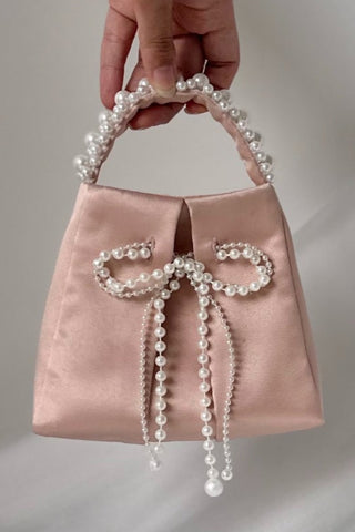 Blush satin bag with pearl bow