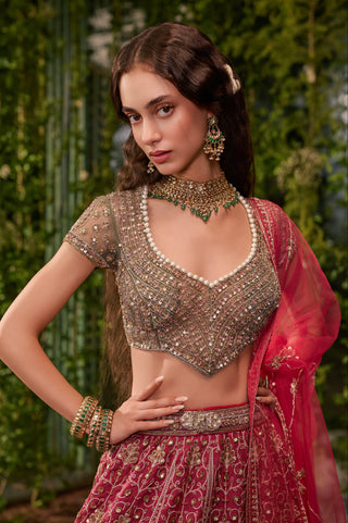 Waist-up view of the olive green blouse with pearl neckline and sequin embroidery by Jigar and Nikita at Mrs. G