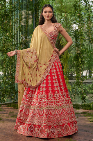 Full-length front view of the carmine lehenga set with gold embroidery and green tulle dupatta by Jigar and Nikita at Mrs. G