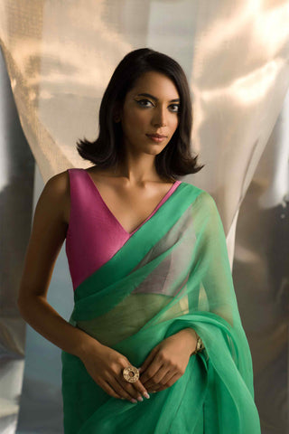 Lush green saree with pink blouse