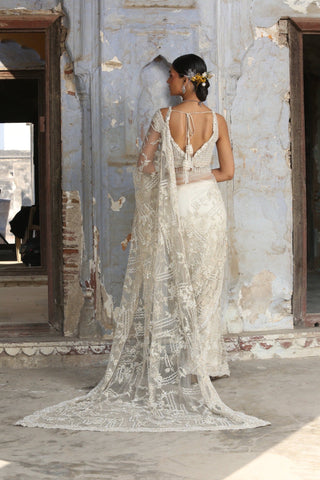 Ivory nihaar dori crystal saree set by Nitika Gujral at Mrs. G