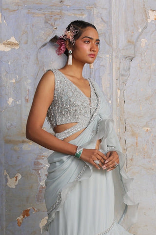 Blue nihaar shimmer georgette saree set by Nitika Gujral at Mrs. G