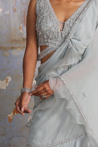 Blue nihaar shimmer georgette saree set by Nitika Gujral at Mrs. G
