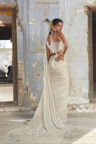 Beige nihaar cutdana crystal saree set by Nitika Gujral at Mrs. G