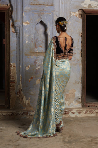 Green nihaar banarasi velvet saree set by Nitika Gujral at Mrs. G