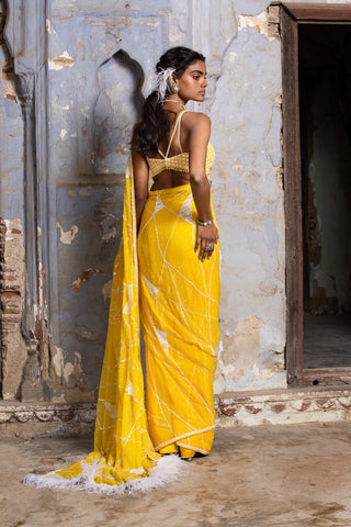Yellow nihaar feather fringe saree set by Nitika Gujral at Mrs. G