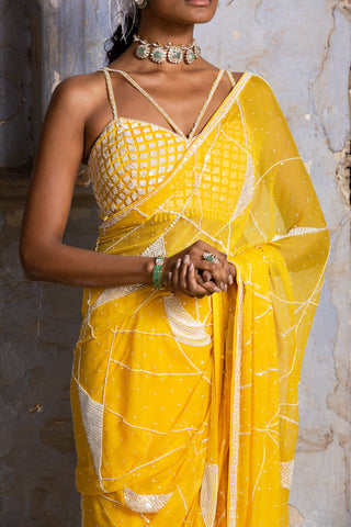 Yellow nihaar feather fringe saree set by Nitika Gujral at Mrs. G