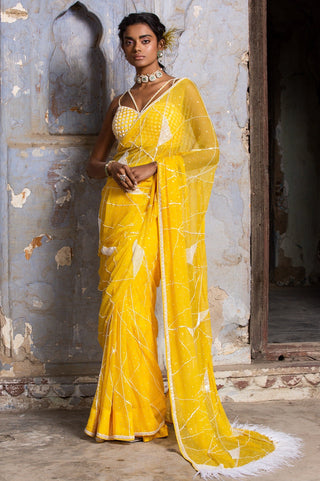 Yellow nihaar feather fringe saree set by Nitika Gujral at Mrs. G