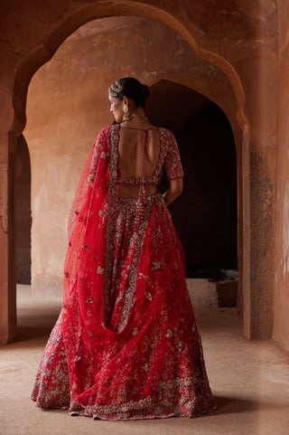 Red tarana floral embroidered lehenga set back view by Nitika Gujral at Mrs. G