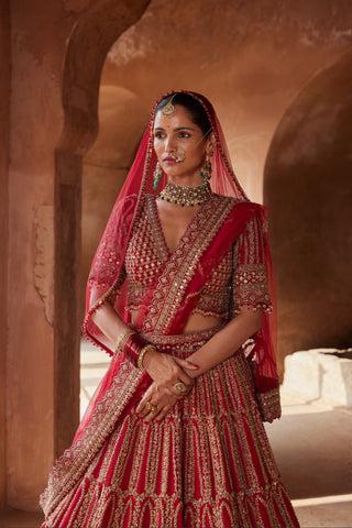 Red tarana zardozi raw silk lehenga set by Nitika Gujral at Mrs. G
