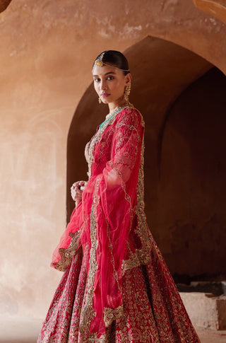 Red tarana embroidered raw silk lehenga set by Nitika Gujral at Mrs. G