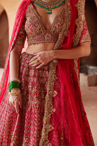 Red tarana embroidered raw silk lehenga set by Nitika Gujral at Mrs. G