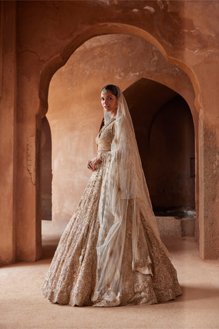 Gold tarana embroidered lehenga set by Nitika Gujral at Mrs. G