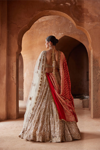 Gold tarana embroidered lehenga set by Nitika Gujral at Mrs. G