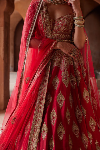 Red tarana cardinal raw silk lehenga set by Nitika Gujral at Mrs. G