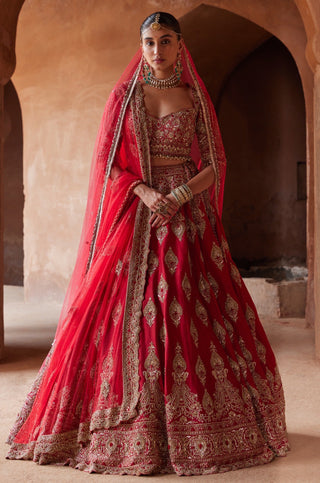 Red tarana cardinal raw silk lehenga set by Nitika Gujral at Mrs. G