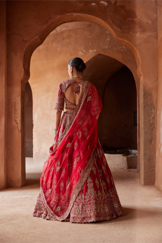 Red tarana cardinal raw silk lehenga set by Nitika Gujral at Mrs. G