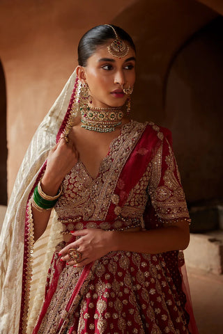 Maroon tarana raw silk lehenga set by Nikita Gujral at Mrs. G