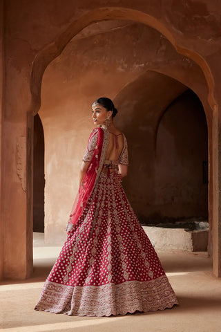 Maroon tarana raw silk lehenga set by Nikita Gujral at Mrs. G