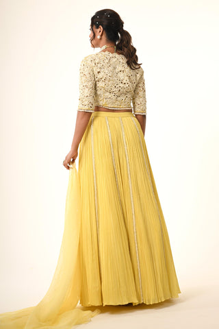 Yellow floral cutwork blouse with lehenga