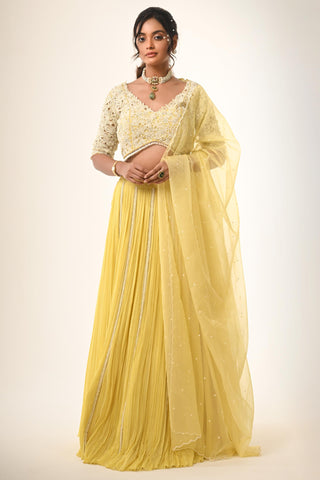 Yellow floral cutwork blouse with lehenga