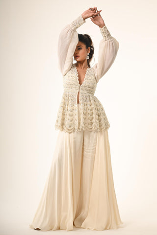 Ivory peplum top with flared pant