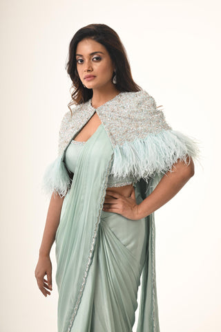 Blue ruffle saree with embroidered cape