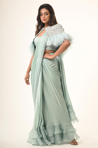 Blue ruffle saree with embroidered cape