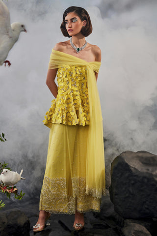 Yellow amour peplum top with trousers and shoulder drape