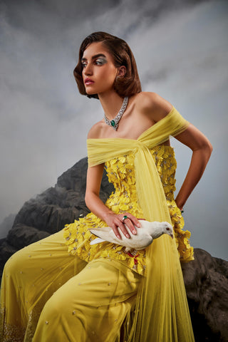 Yellow amour peplum top with trousers and shoulder drape