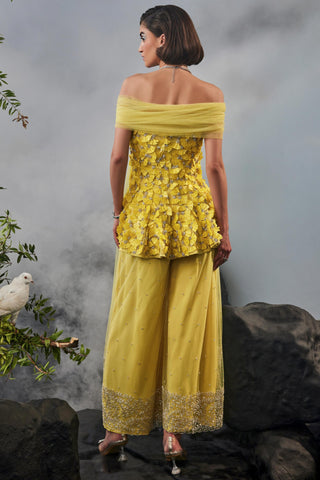 Yellow amour peplum top with trousers and shoulder drape