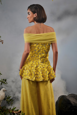 Yellow amour peplum top with trousers and shoulder drape