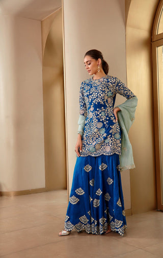 Side profile of the jade blue rasm kurta and sharara set with the mint dupatta by Osaa by Adarsh at Mrs. G
