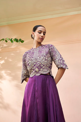 Low-angle close-up of aubergine top with dense zardozi and scalloped hem by Osaa by Adarsh at Mrs. G
