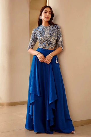 Front view of jade blue top and cascading draped skirt with waist tassel by Osaa by Adarsh at Mrs. G