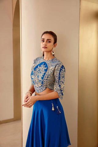 Close-up three-quarter view of jade blue oval embroidered top with scalloped sleeves by Osaa by Adarsh at Mrs. G