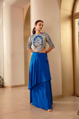 Standing view of jade blue embroidered top and tiered skirt with waist tassel by Osaa by Adarsh at Mrs. G