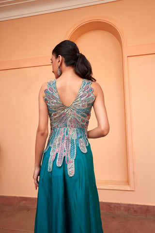 Back view of pine green deep V-back top with feather-wing embroidery and flowing skirt by Osaa by Adarsh at Mrs. G