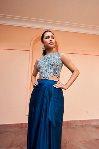 Close-up three-quarter view of jade blue crop top with silver-toned scalloped embroidery and draped waist by Osaa by Adarsh at Mrs. G
