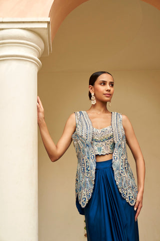 Close-up of jade blue embroidered jacket and bustier with silver paisley-style zardozi by Osaa by Adarsh at Mrs. G