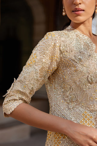 Close-up of beige champagne jacket sleeve with 3D flowers, sequins and mustard lattice work by Osaa by Adarsh at Mrs. G