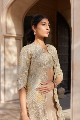 Three-quarter portrait of beige champagne open jacket and bustier with sequin embroidery by Osaa by Adarsh at Mrs. G