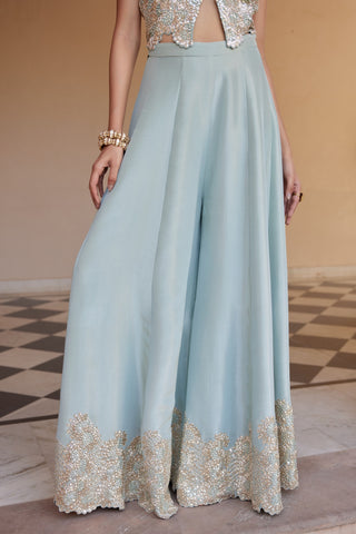 Close-up of tea green wide-leg flared pants with embroidered scalloped hem border by Osaa by Adarsh at Mrs. G