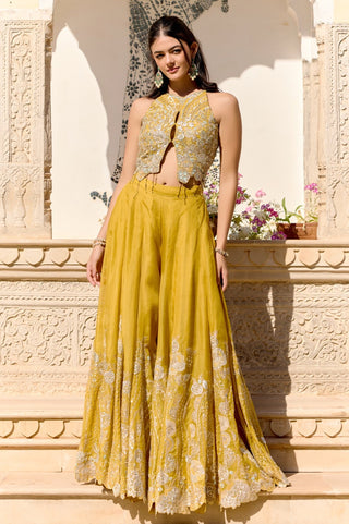Front view of canary yellow halter top and wide garara with floral hem border by Osaa by Adarsh at Mrs. G