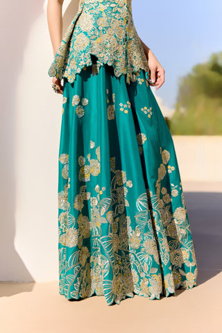Close view of pine green garara with a deep leaf and floral embroidered hem border by Osaa by Adarsh at Mrs. G