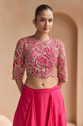 Close-up of scarlet top with elbow-length sleeves and gold zardozi arch panels by Osaa by Adarsh at Mrs. G