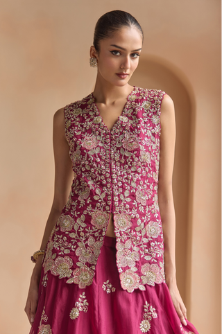 Waist-up view of sangria plum V-neck jacket with scalloped floral hem and zardozi flowers by Osaa by Adarsh at Mrs. G