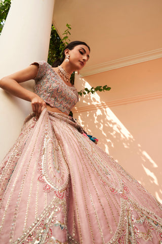 Low-angle view of soft berry flared lehenga with paisley zardozi panels by Osaa by Adarsh at Mrs. G